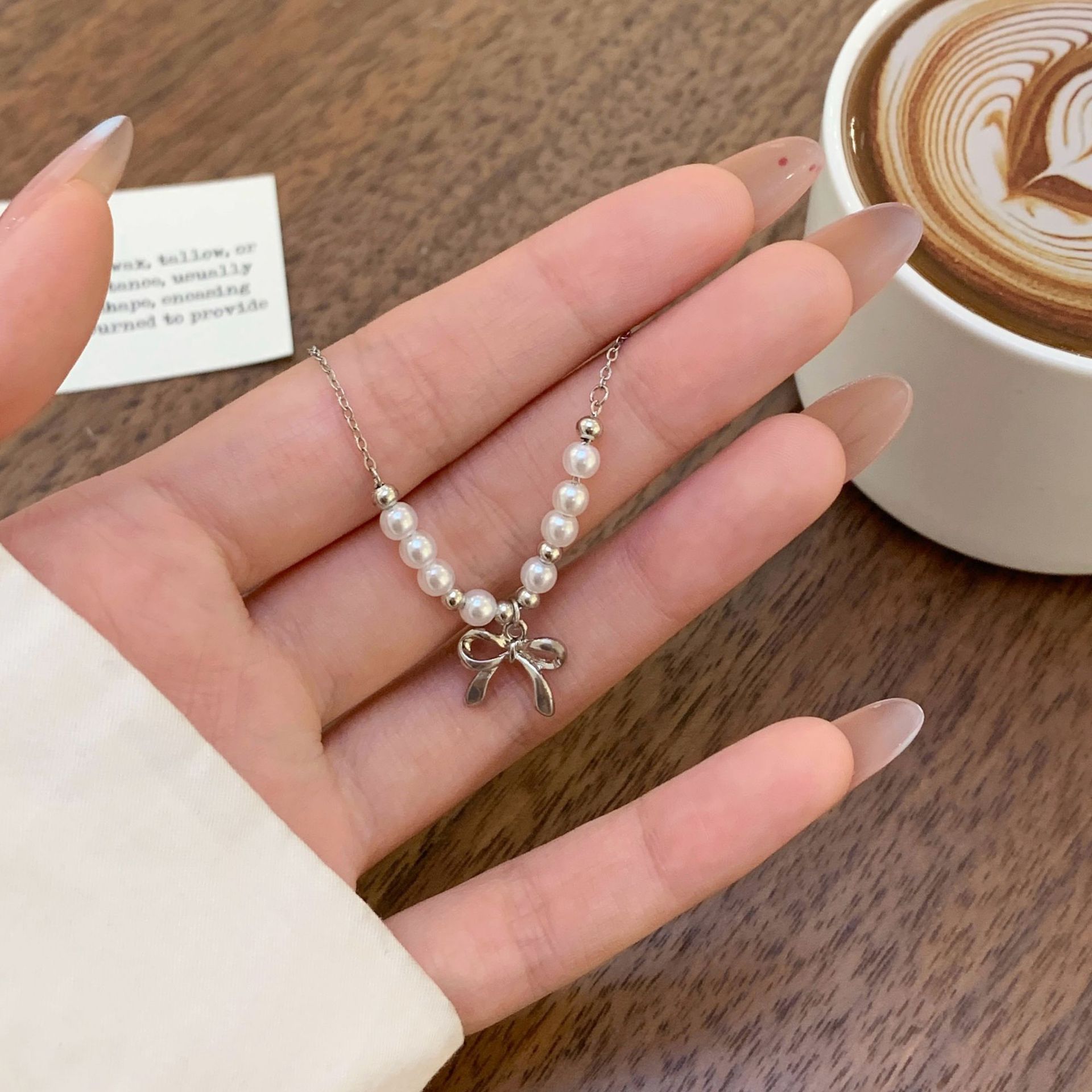 Summer niche design bow pearl bracelet, feminine charm, white K light luxury, high-end, fashionable and sweet jewelry Application Scenario