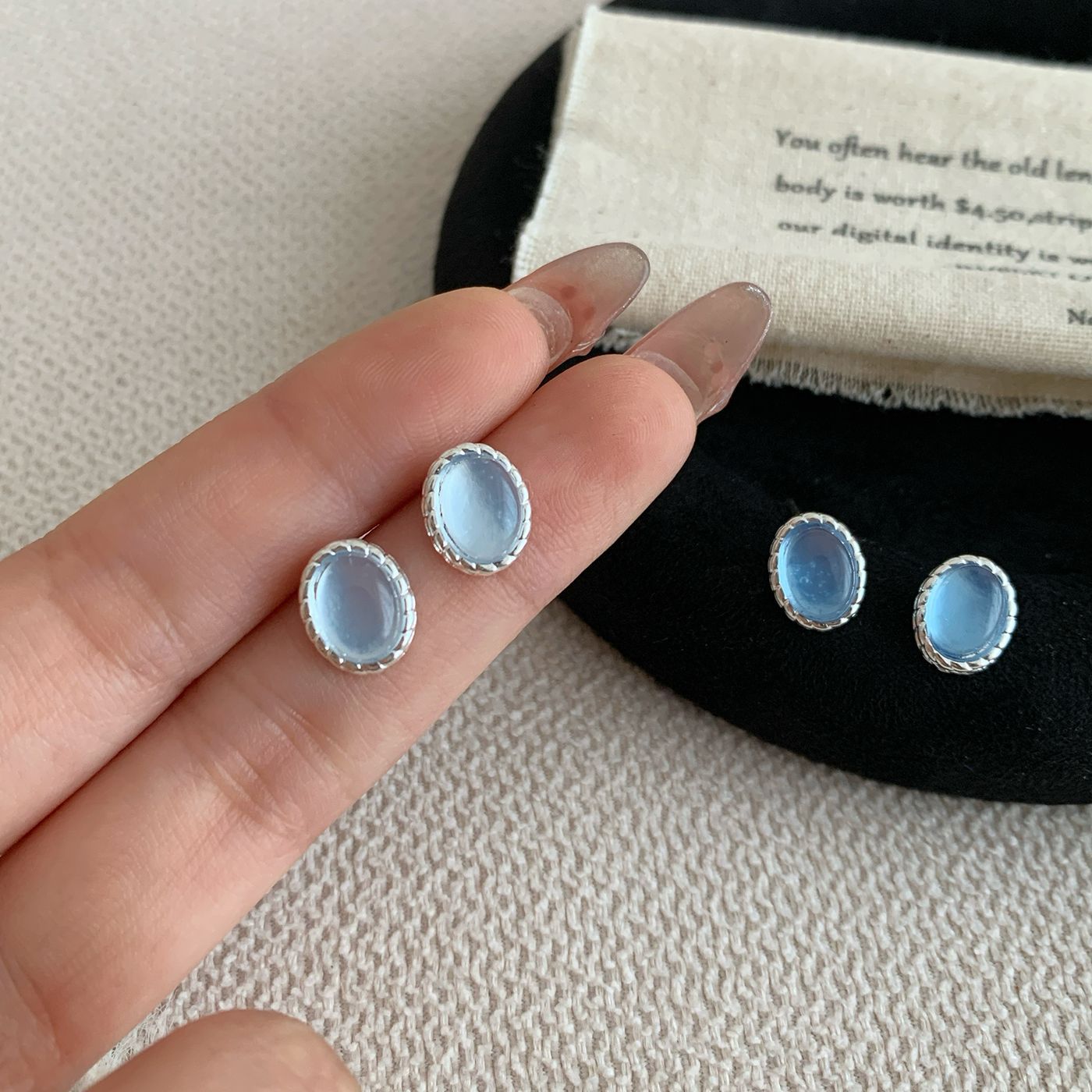 Fresh and small aquamarine blue oval stud earrings, women's silver needle, simple and unique style, design sense, high-end feel, gentle earrings details Picture