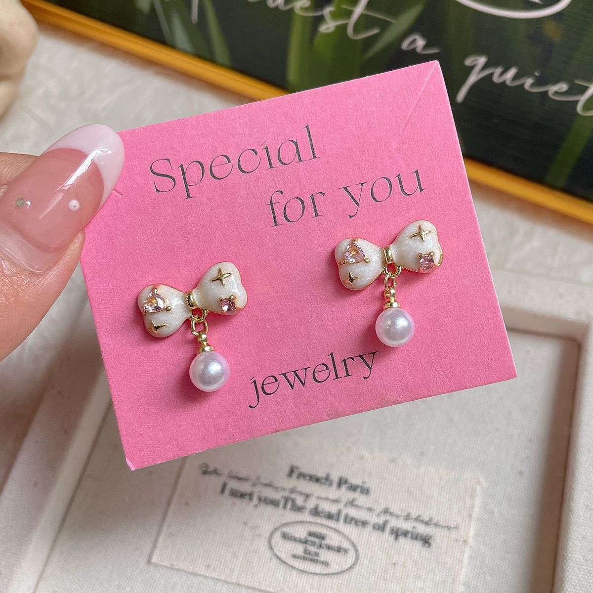 Korean style unique pink zircon oil drip bow earrings, women's silver needle pearl tassel pendant, versatile and sweet earrings full figure