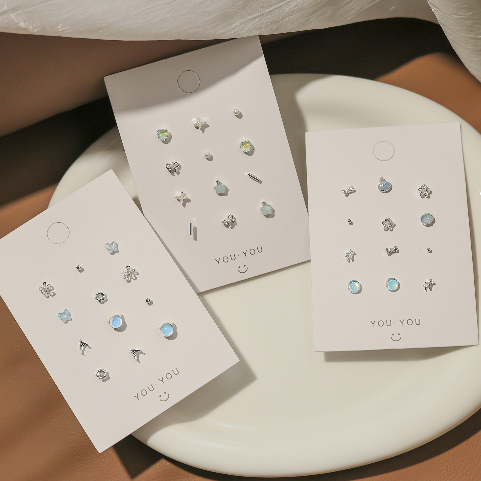 A small and exquisite silver needle stud set in sea blue, versatile and simple daily earrings, personalized and elegant earrings for women wholesale full figure