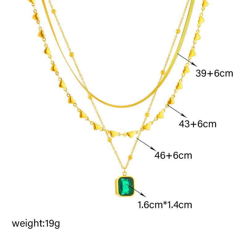This is a high-end and versatile necklace with a multi-layer mixed and matched European and American fashion style, featuring a heart-shaped snake bone chain and an emerald diamond square pendant Application Scenario
