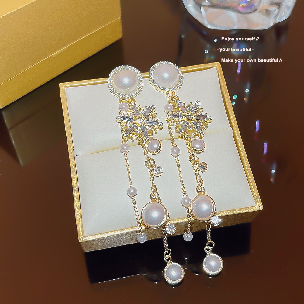Wholesale of 2025 new trendy and trendy retro snowflake tassel earrings with a high-end Korean style and elegant light luxury style details Picture