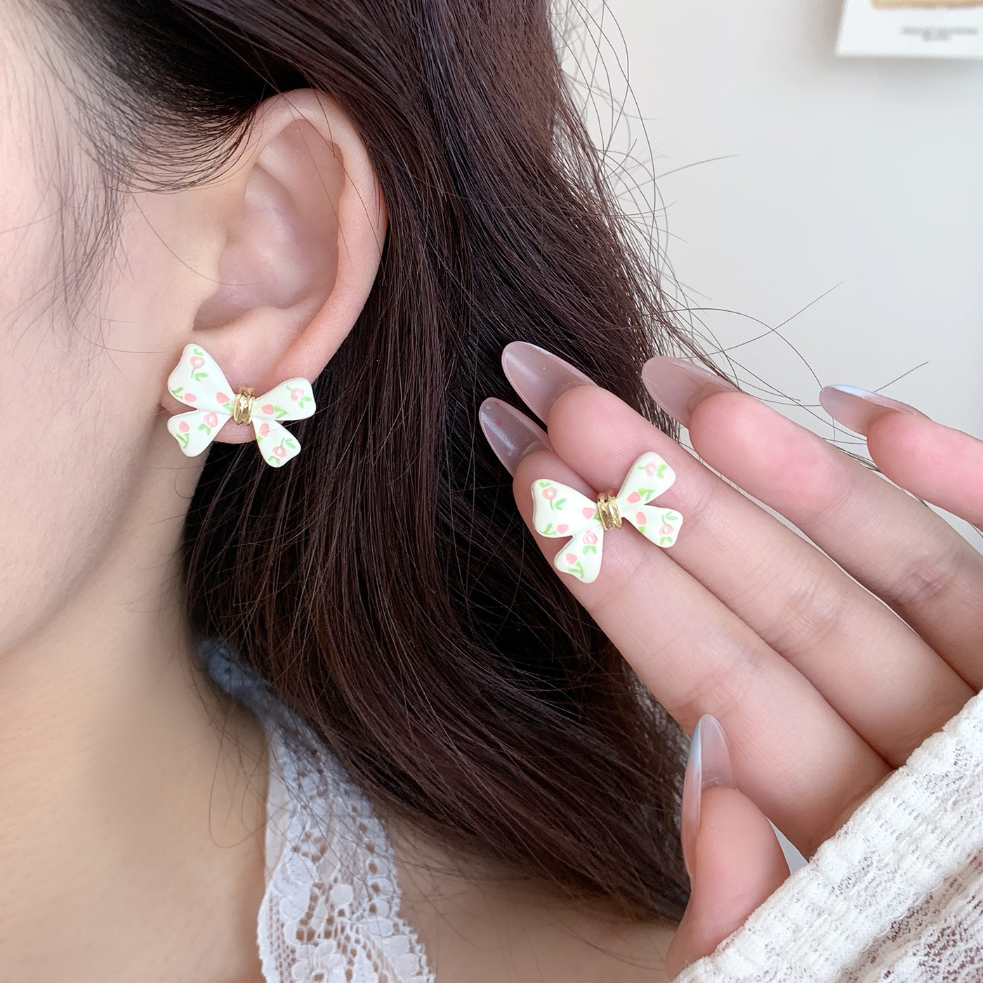 Summer new oil-dripping floral bow stud earrings, women's silver needle, fresh design, niche, simple and versatile earrings details Picture