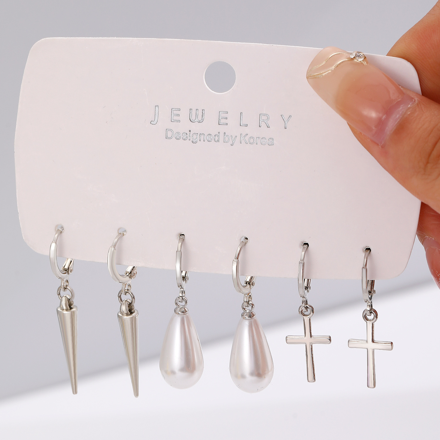 European and American cross-border earrings, fashionable and simple ear ring and ear buckle set, pointed cone rivets, water drop cross, star earrings for women details Picture