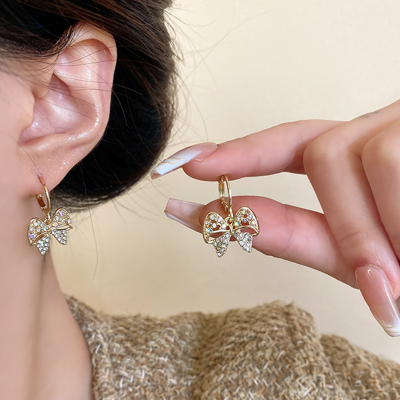 Korean-style full-diamond hollowed-out bow earrings for women, a light luxury, super ethereal, high-end and unique personality bestseller details Picture