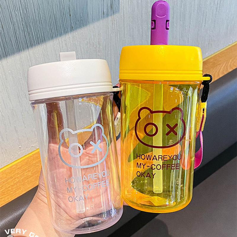 The popular plastic cup in the ins style is simple, trendy and fashionable. It is a portable hand-held cartoon student double drinking cup details Picture