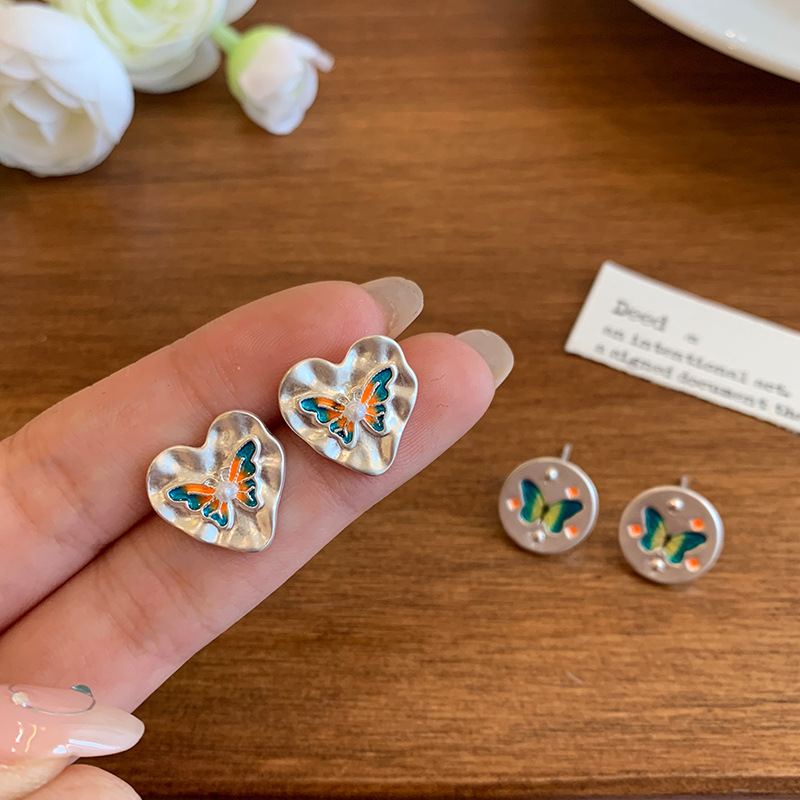 French matte silver retro color oil drip butterfly stud earrings for women's silver needle new niche high-end heart-shaped light luxury earrings details Picture