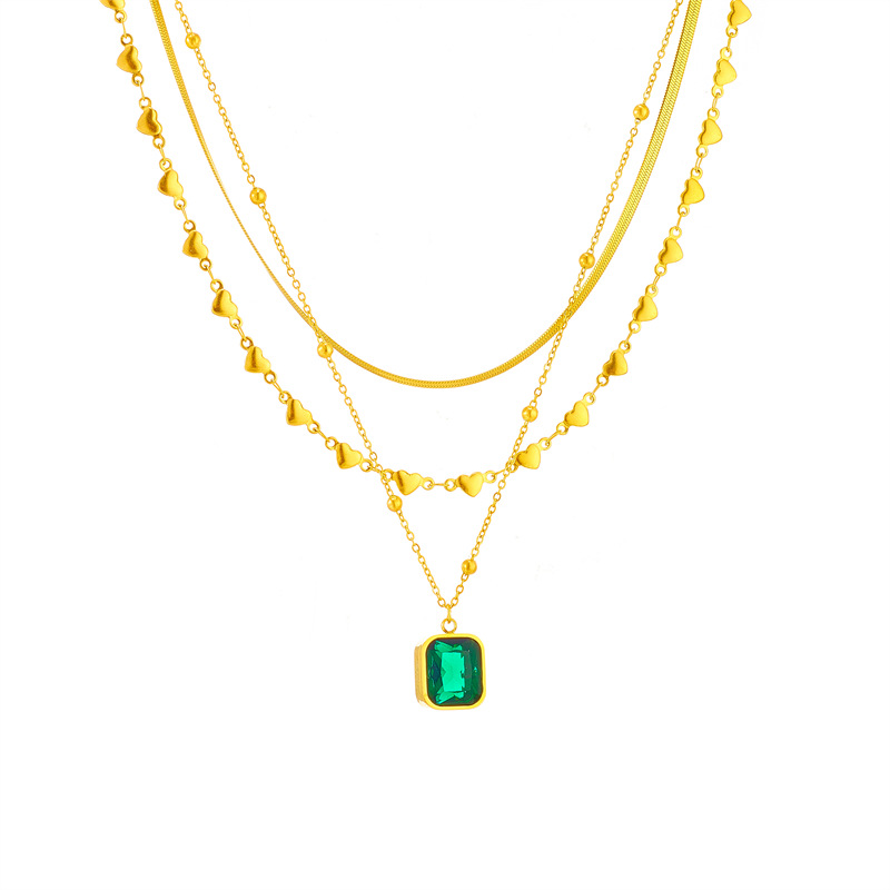 This is a high-end and versatile necklace with a multi-layer mixed and matched European and American fashion style, featuring a heart-shaped snake bone chain and an emerald diamond square pendant Item Picture