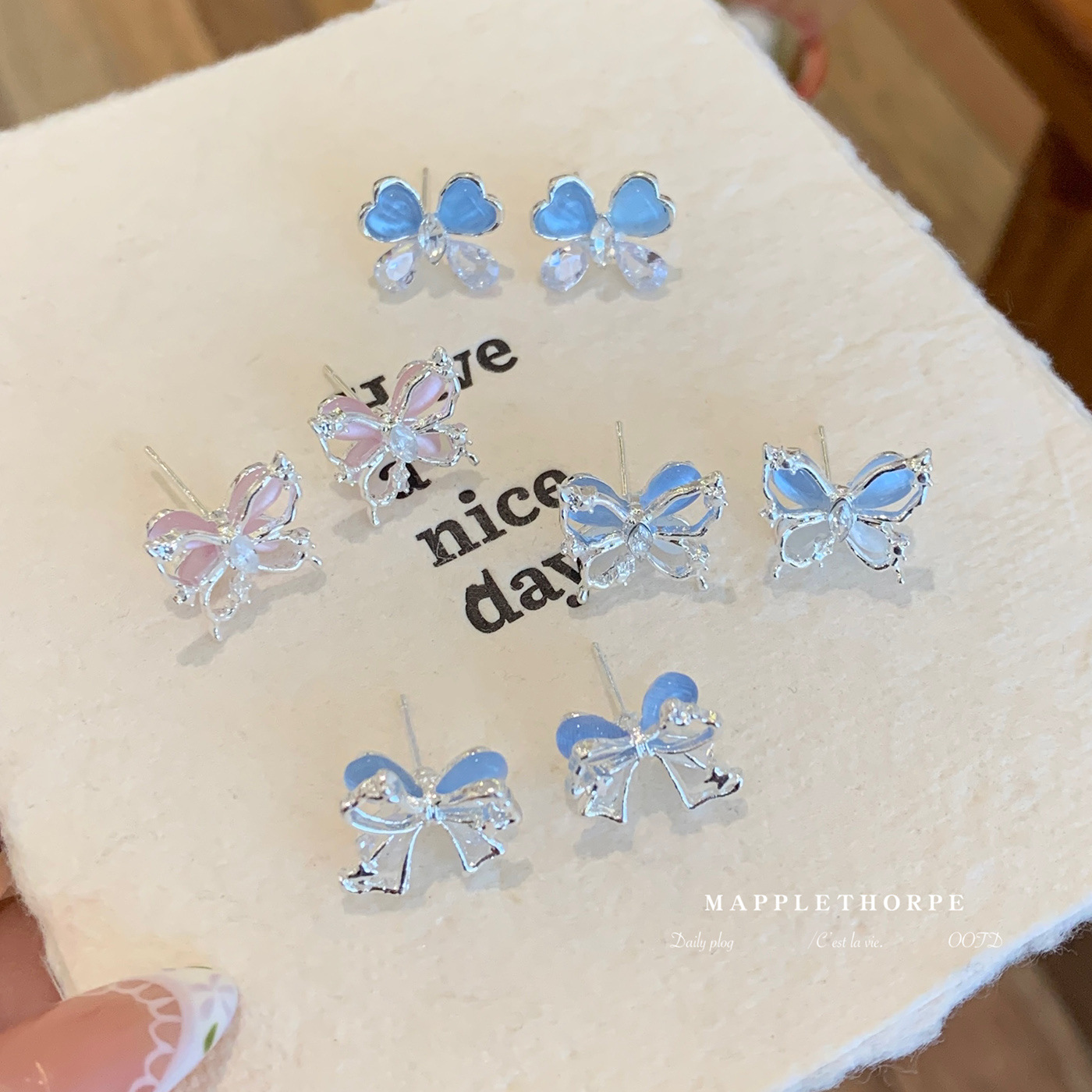 Spring and summer pink cat's eye stone double-layer butterfly stud earrings for women in an ins style, light luxury, three-dimensional, simple and ethereal sweet earrings full figure