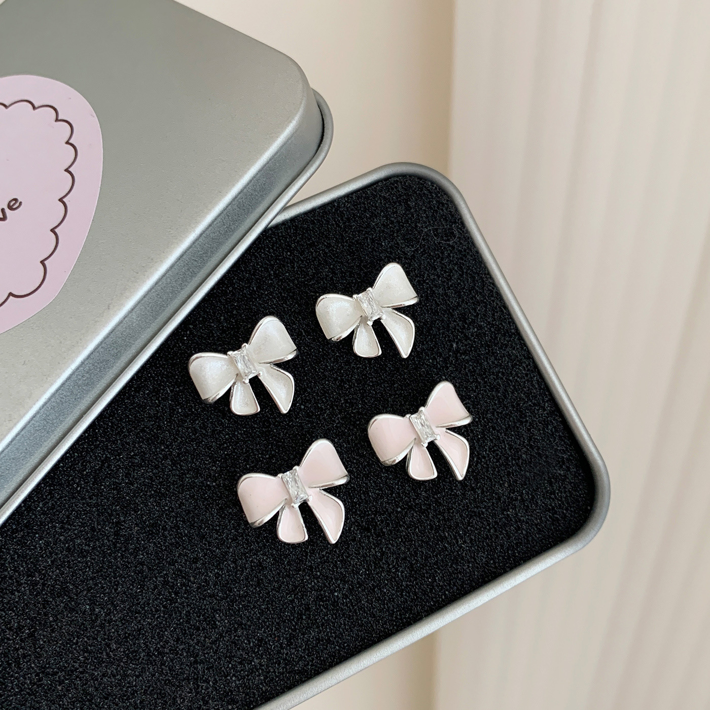 Korean spring and summer exquisite pink bow stud earrings, silver needles for women, fashionable commuting style, girlish heart, high-end sense earrings Application Scenario