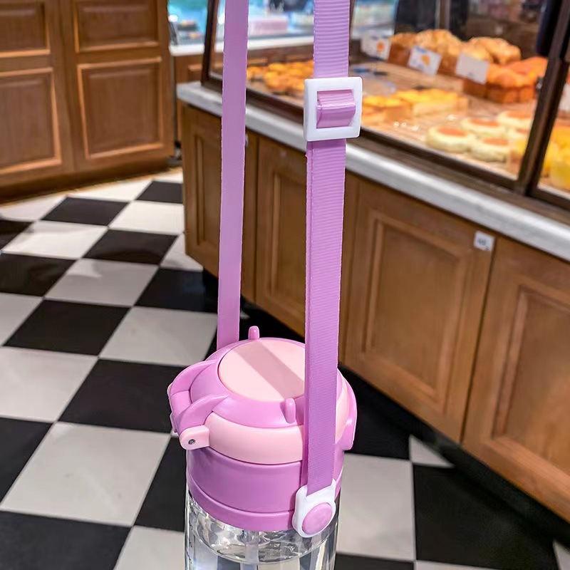 New dual-purpose water bottle for primary school students, featuring a drawstring, straw, cartoon, shockproof plastic water bottle with a jumping cap and scale Application Scenario