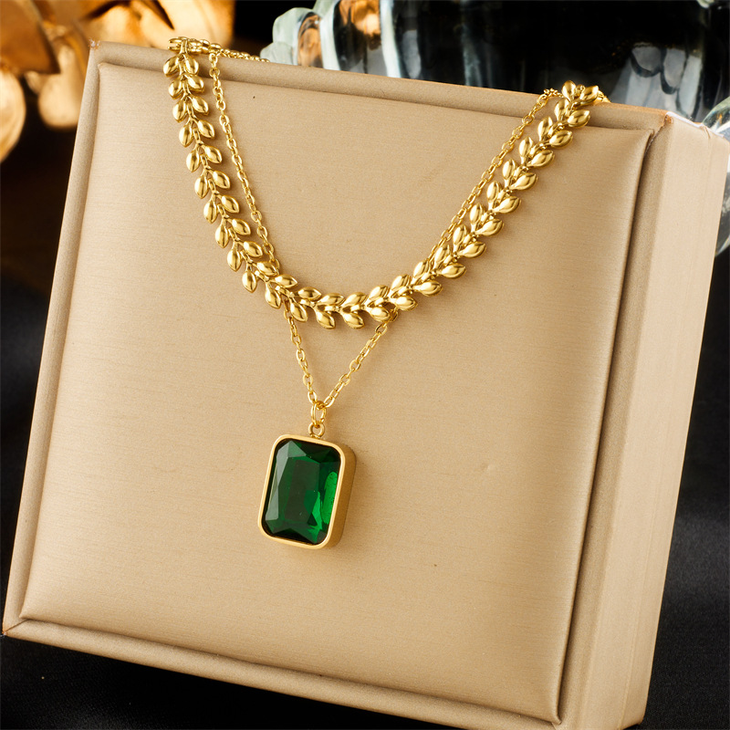 A fashionable and high-end, light luxury style emerald square gemstone pendant collarbone chain titanium steel metal multi-layer necklace full figure