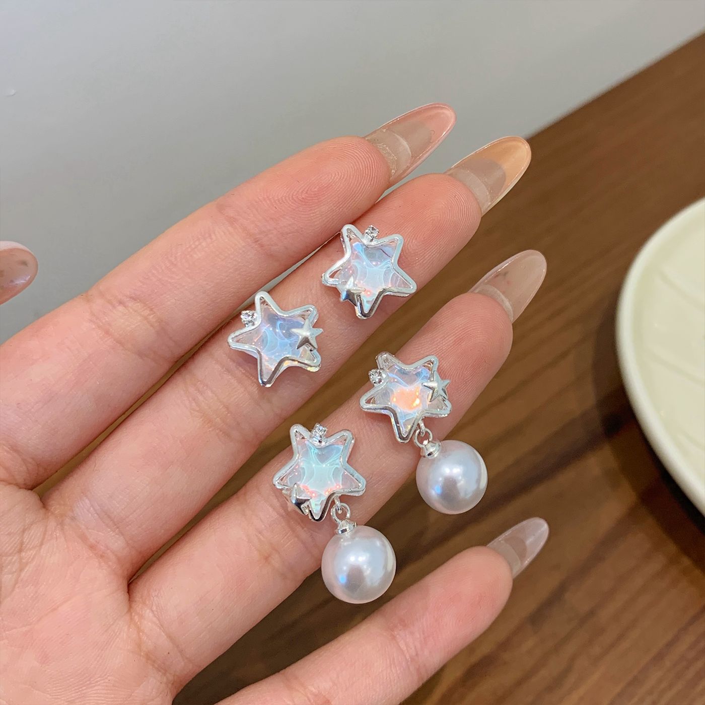 Summer copper micro-inlaid ocean shining star earrings, women's silver needle, fresh and delicate pearl, niche and light luxury design earrings Application Scenario