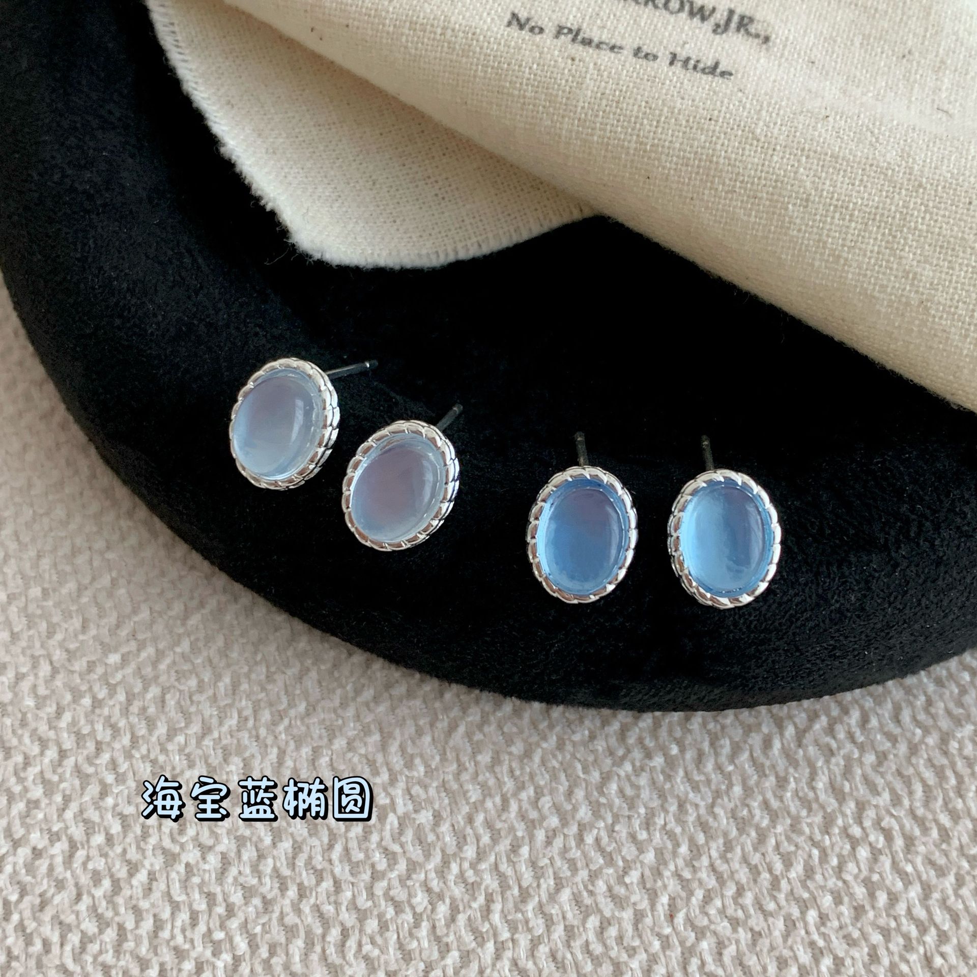 Fresh and small aquamarine blue oval stud earrings, women's silver needle, simple and unique style, design sense, high-end feel, gentle earrings full figure