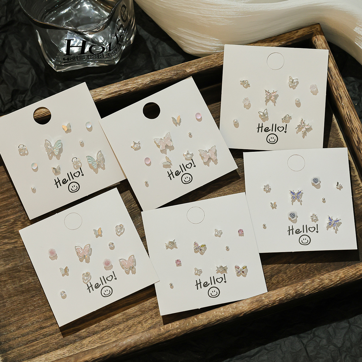 Sweet and cute silver needle, small and exquisite stud earrings, niche new set, ins fresh glitter butterfly earrings wholesale full figure