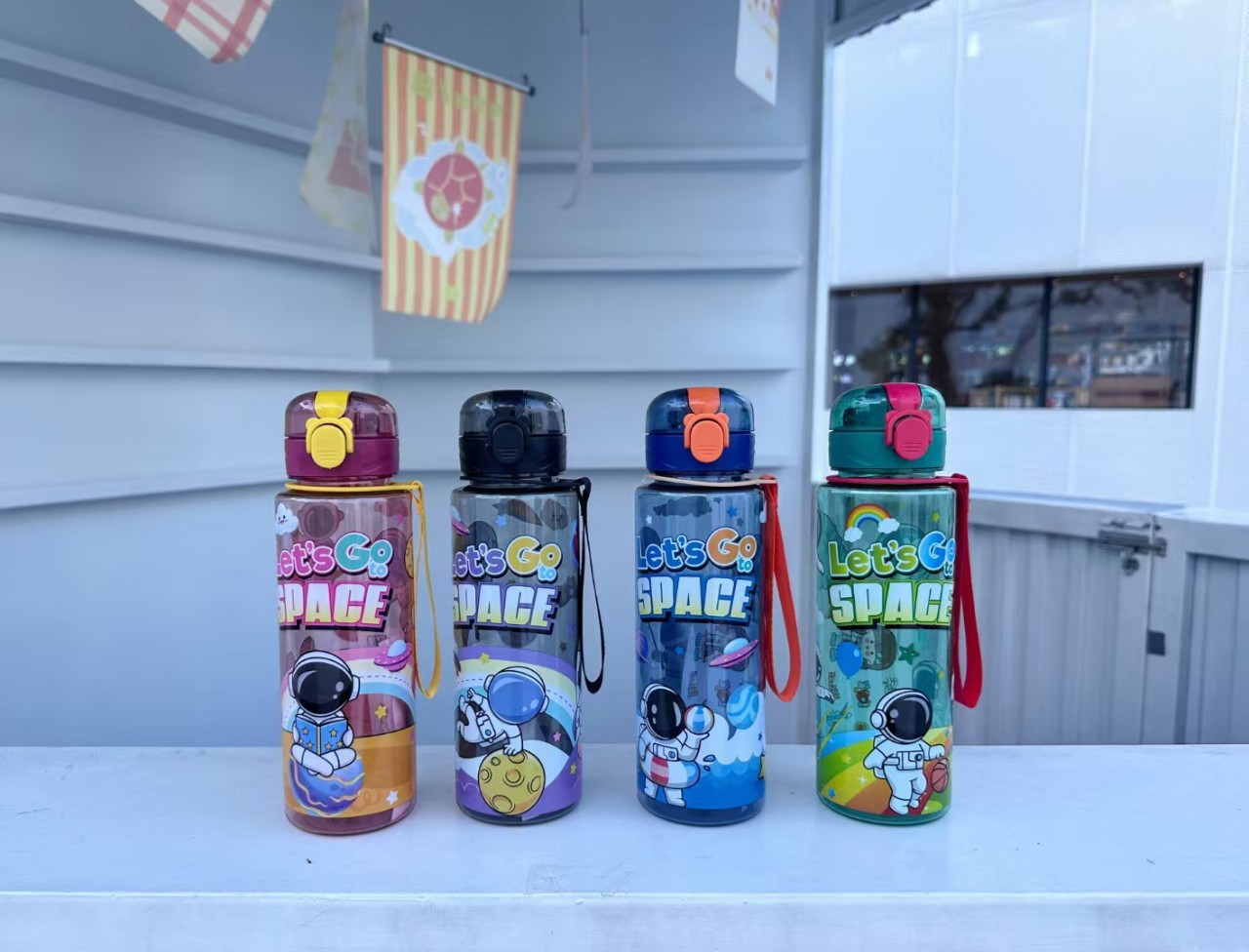TEMU/SHEIN cross-border bestseller cartoon astronaut pattern direct drinking plastic cup portable rope student cup Application Scenario