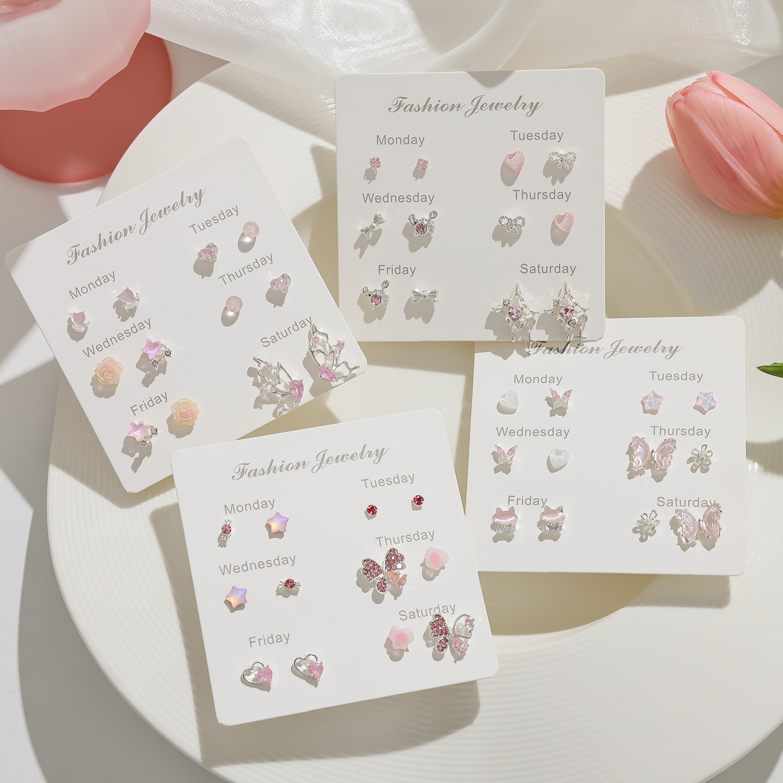 Pink zircon butterfly stud one-week set, cute and girlish heart earrings, high-end and niche silver needle earrings wholesale full figure