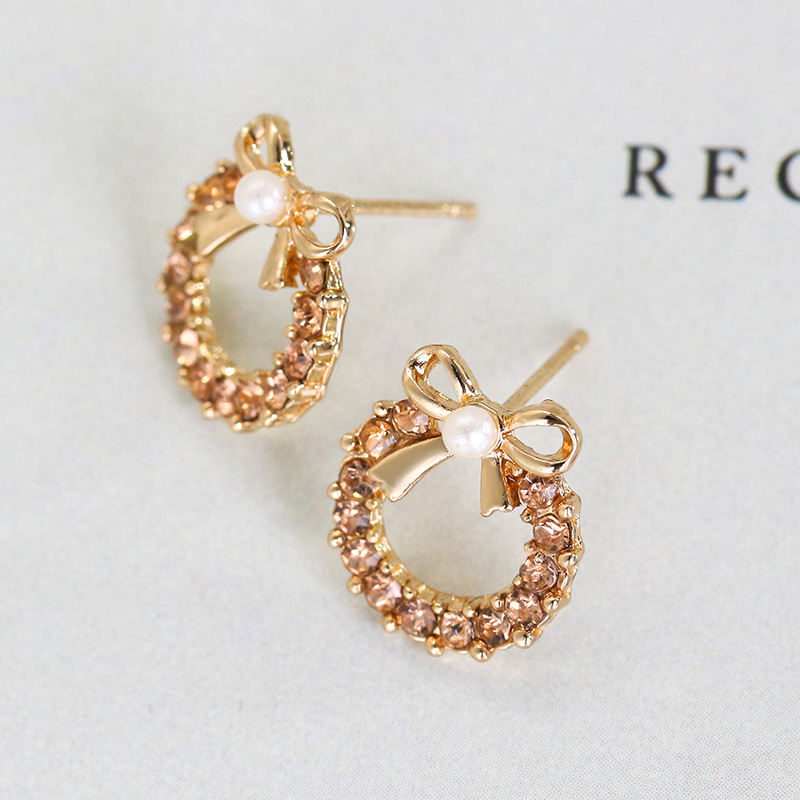 European and American inS-style pearl bow stud earrings, women's unique and elegant style, studded with colorful diamonds, hollowed-out round earrings, cross-border earrings Specification drawing