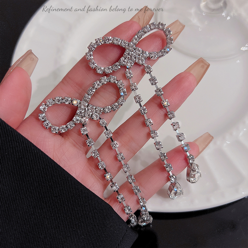 New Korean version bow tassel earrings for autumn and winter, high-end long earrings, exaggerated and elegant stud earrings for women wholesale full figure