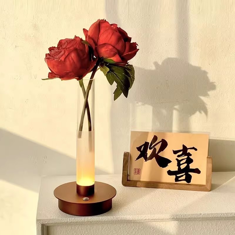 A vase with a lantern in it details Picture