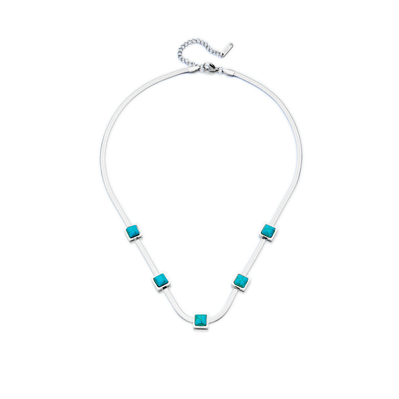 A new cross-border fashion collarbone necklace with a unique design of gold and silver dual-color titanium steel snake bone chain and turquoise cubes Item Picture
