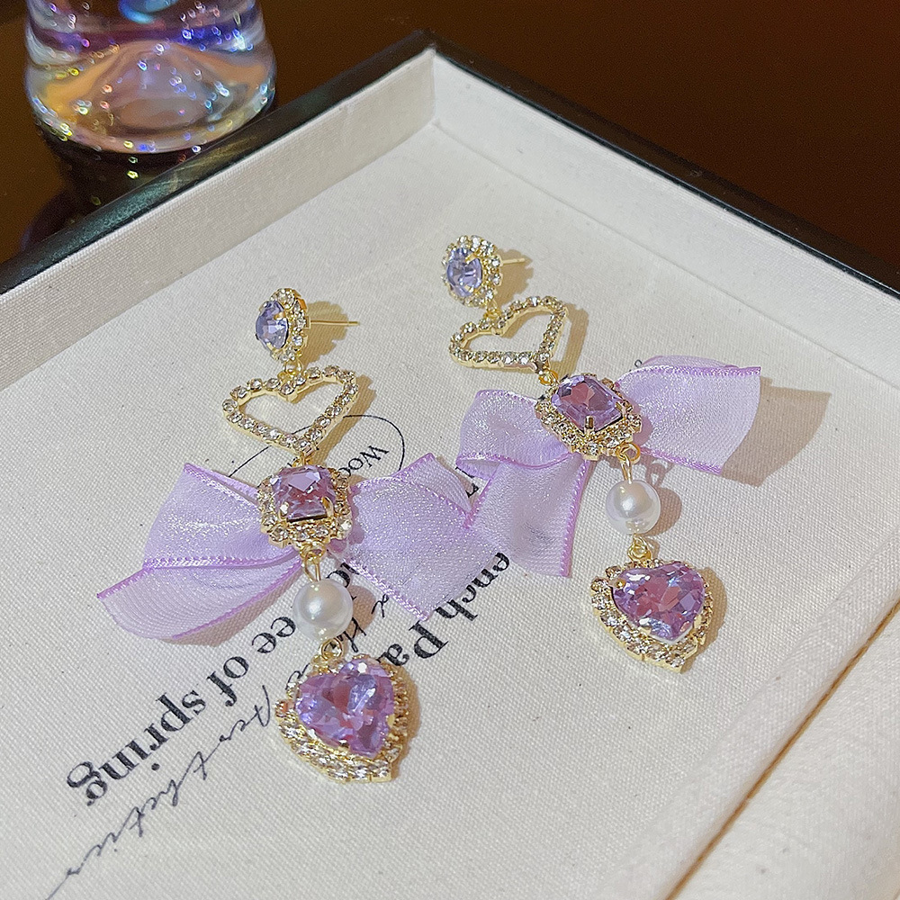 Korean-style long, exquisite heart-shaped bow tassel earrings, nightclub socialite style, light luxury design sense earrings for women Application Scenario