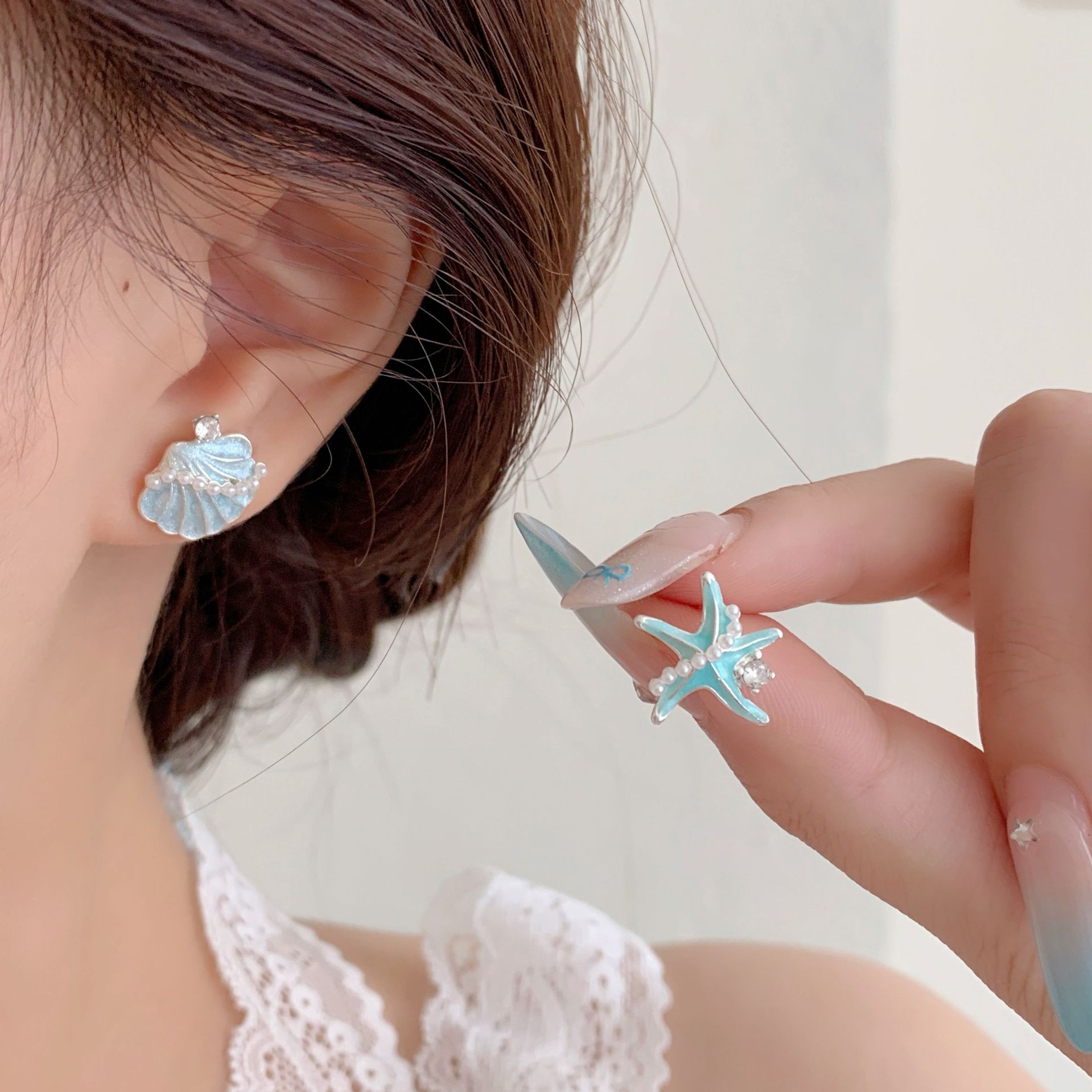 Ocean vacation style blue starfish shell stud earrings, women's silver needle, fresh and versatile design sense, exquisite and sweet earrings Specification drawing