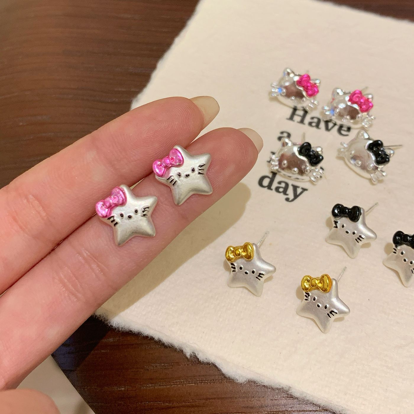 Fun cartoon KT head cat stud earrings Collection, Girls' silver needle Sweet and cool Y2K bow five-pointed star student earrings Specification drawing