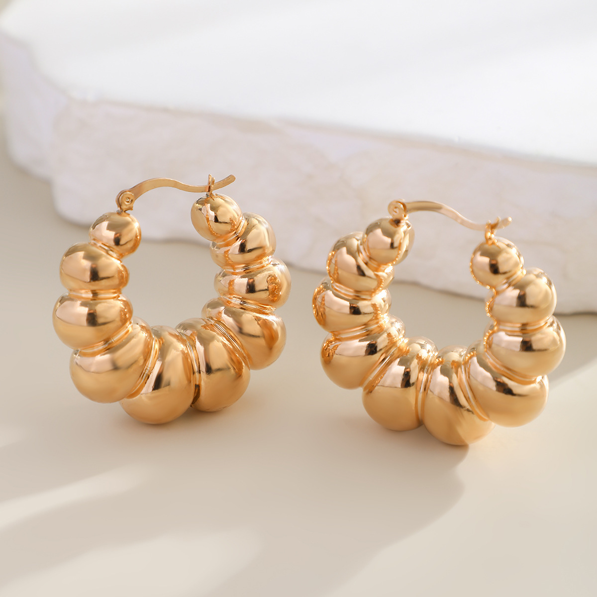 Exaggerated French round metal large earrings from Europe and America, simple and irregular texture, and niche stud earrings Application Scenario