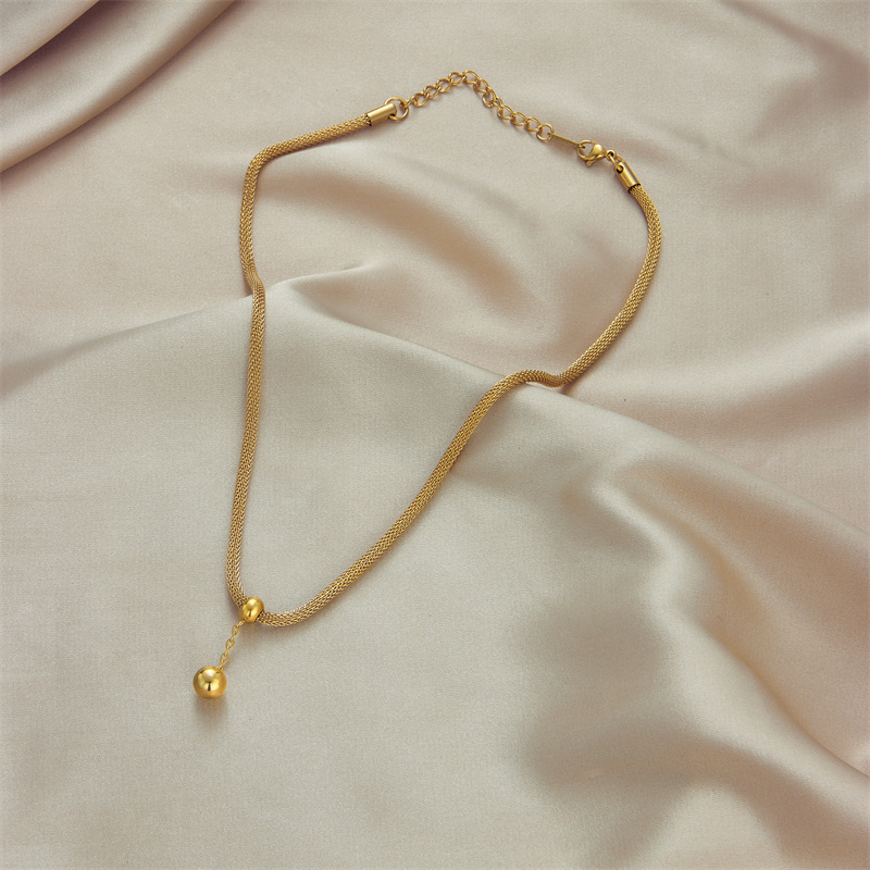 Korean version fashionable, elegant, high-end and niche design, hollowed-out cylindrical chain, gold bead tassel pendant, titanium steel jewelry necklace Specification drawing