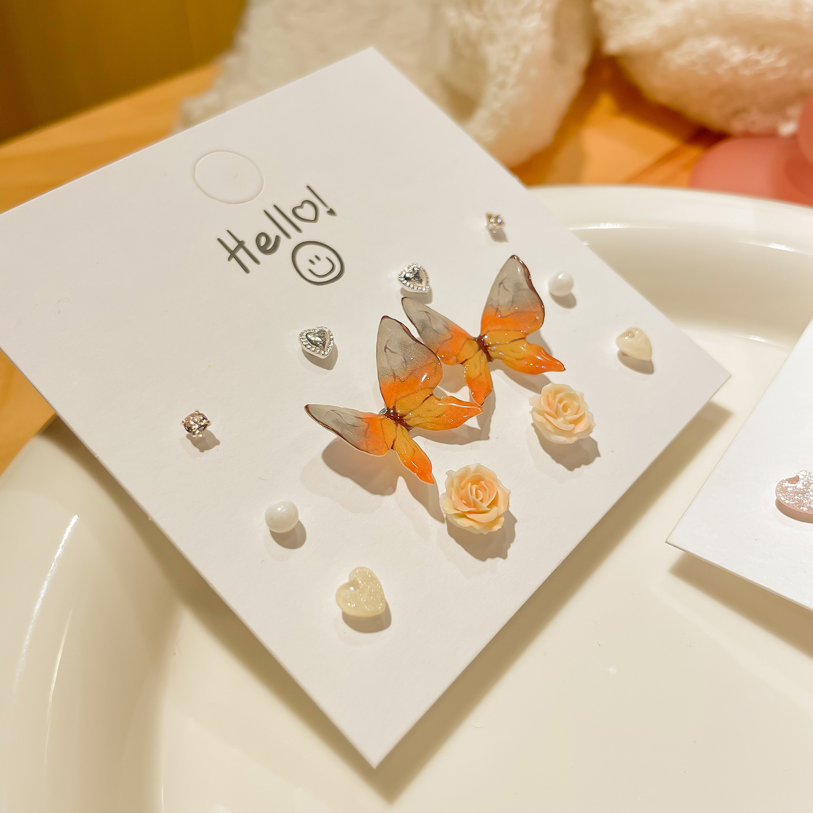 A one-week set of flowing resin butterfly stud earrings for girls, cute and sweet, small silver needle earrings, personalized and versatile earrings details Picture