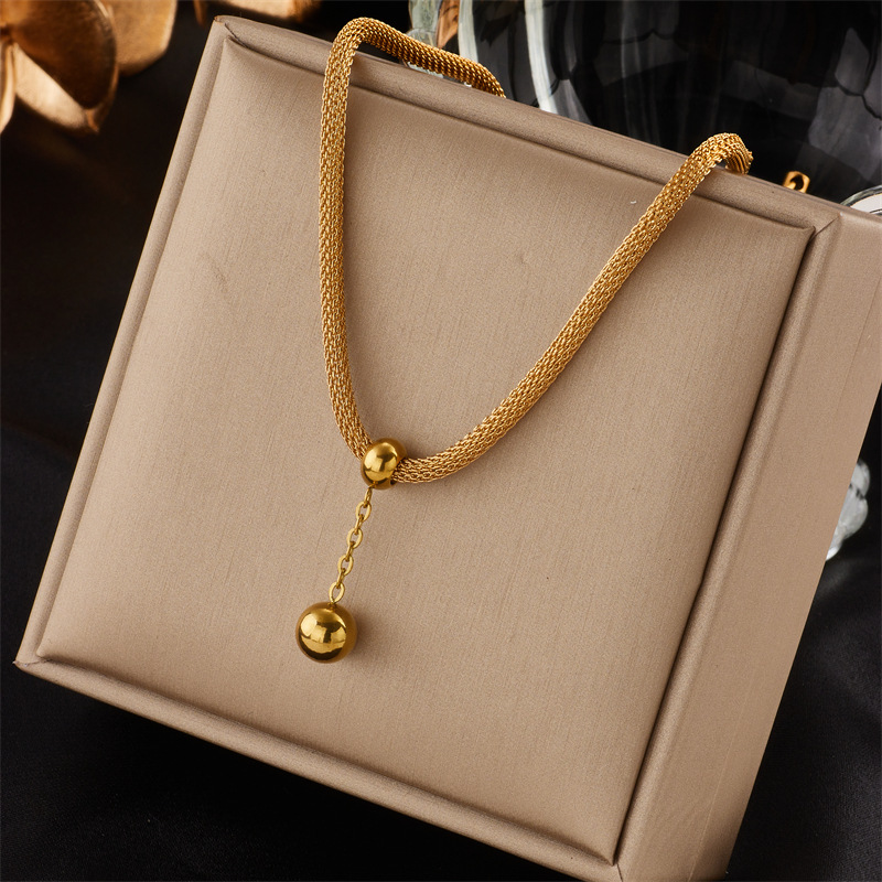 Korean version fashionable, elegant, high-end and niche design, hollowed-out cylindrical chain, gold bead tassel pendant, titanium steel jewelry necklace full figure