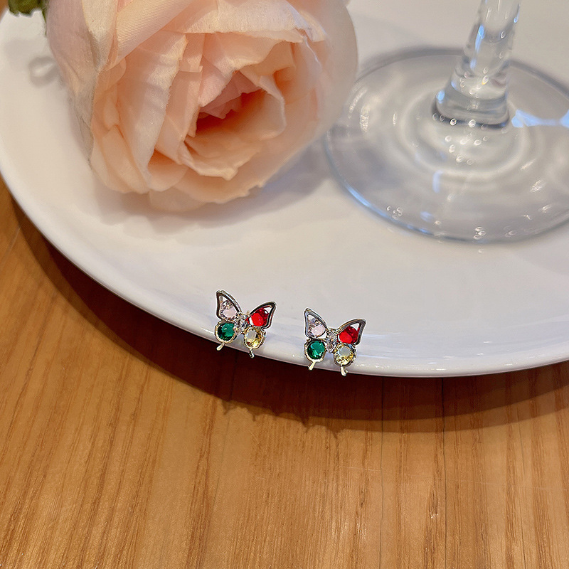 S925 Silver Needle, a new Korean colorful butterfly zircon earring, exudes a high-end feminine charm. It is exquisite, compact and versatile Application Scenario