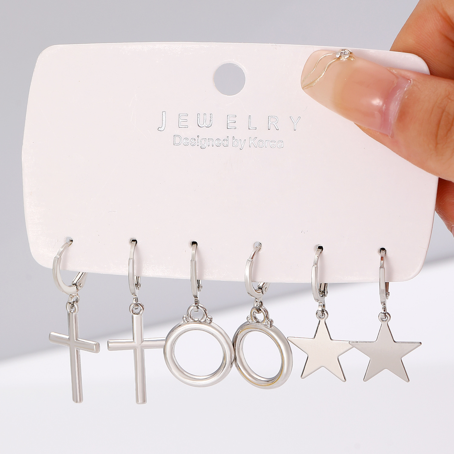European and American cross-border earrings, fashionable and simple ear ring and ear buckle set, pointed cone rivets, water drop cross, star earrings for women Application Scenario