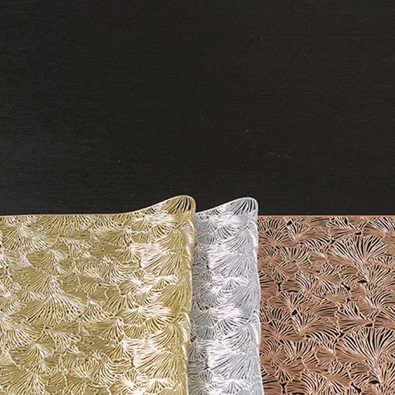 Factory direct sales of Ginkgo leaf hollowed-out placemats, hotel and home decoration, PVC waterproof and wear-resistant placemats, heat insulation pads wholesale