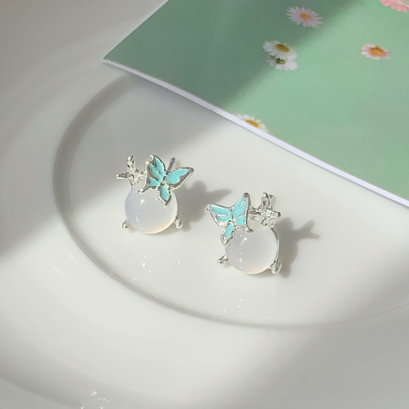 Summer sweet oil-dripping butterfly cat's eye stone round ear stud silver needle women's small and exquisite design sense girlish heart earrings full figure