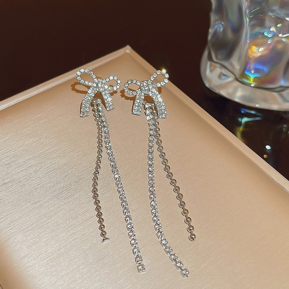 S925 Silver Needle Super Shiny, simple and fashionable bow earrings, niche high-end, trendy design, long earrings wholesale full figure