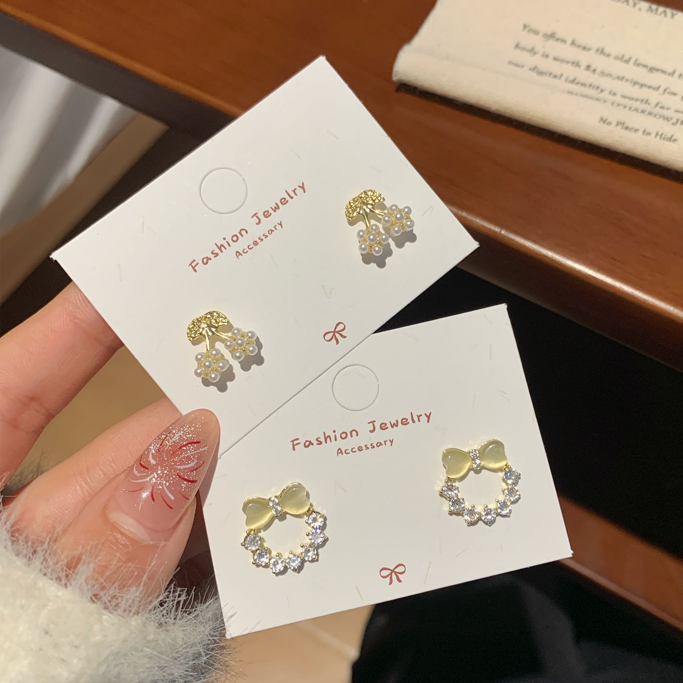 Spring Korean-style exquisite cat's eye stone bow pearl ring stud earrings, women's silver needle diamond-encrusted high-end and elegant earrings full figure