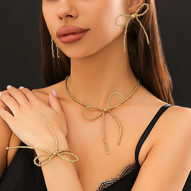 The popular BowEarring bow tassel necklace in Europe and America is a unique and elegant French beaded knot sweet and cool necklace thumbnail