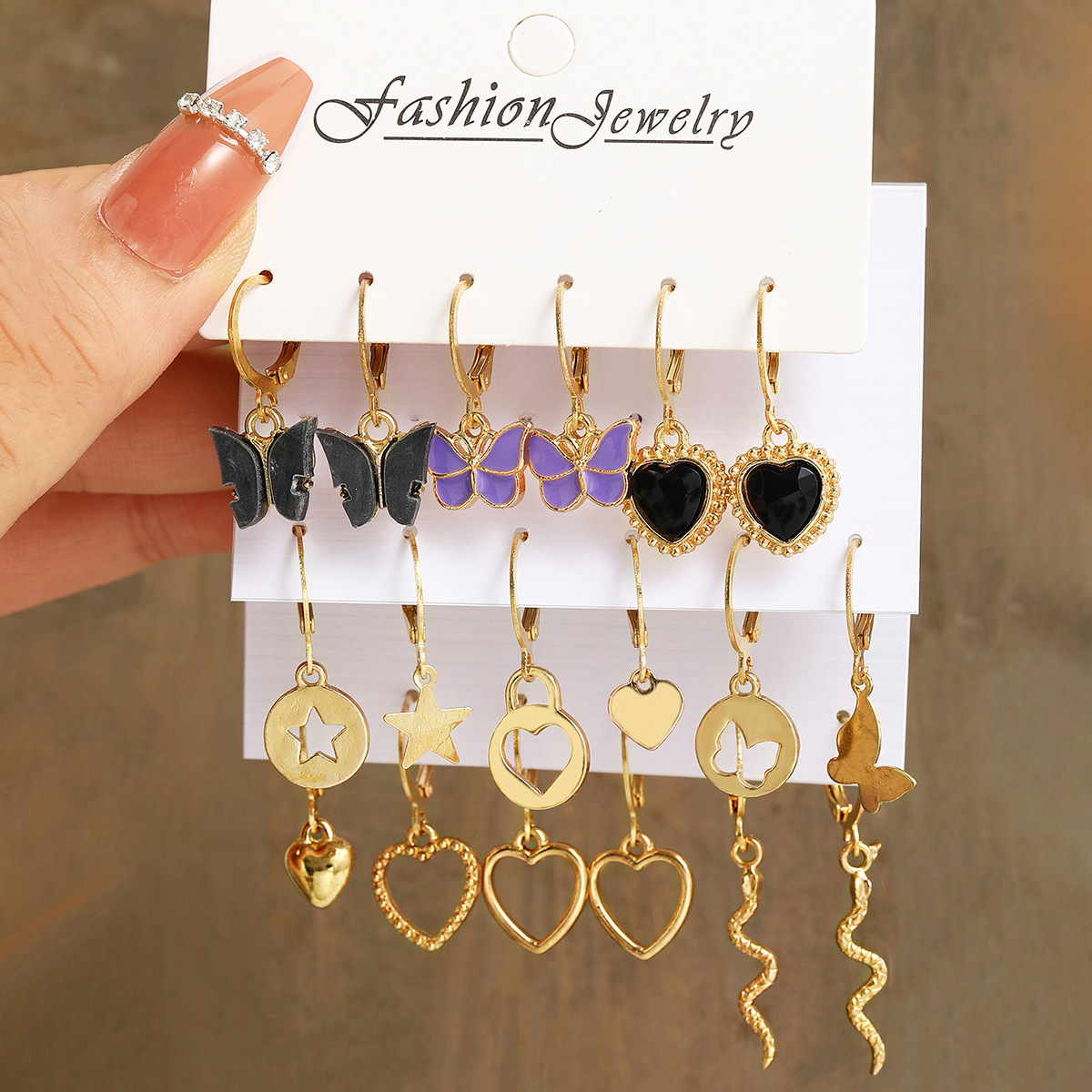 Creative high-end black heart earrings, acrylic butterfly earrings, women's fashionable combination stud earrings 9-piece set full figure