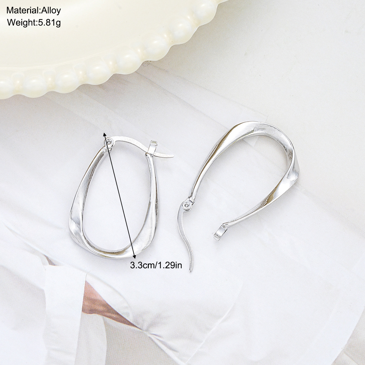 Wholesale of new cross-border Mobius fashion trend large earrings, niche and elegant ins simple women's twisted ear buckles details Picture