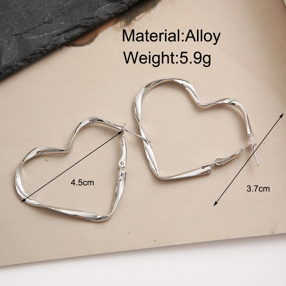 earring European and American cross-border Instagram niche design earrings, unique and simple, irregular hollowed-out heart-shaped ear loops for women Application Scenario