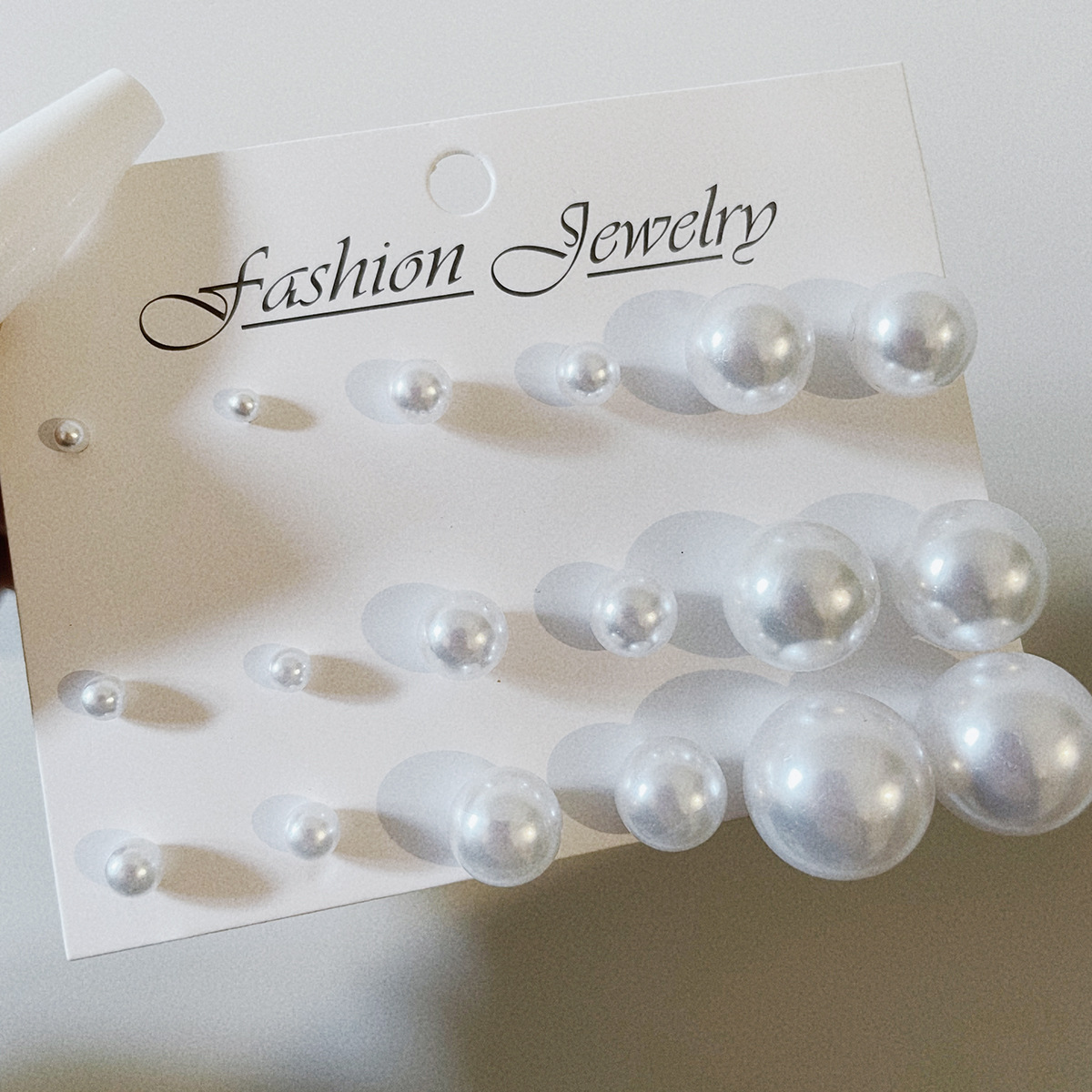 New cross-border simple and classic small and medium-sized imitation pearl stud earrings, 12 pairs in a row, fever French retro stud earrings details Picture