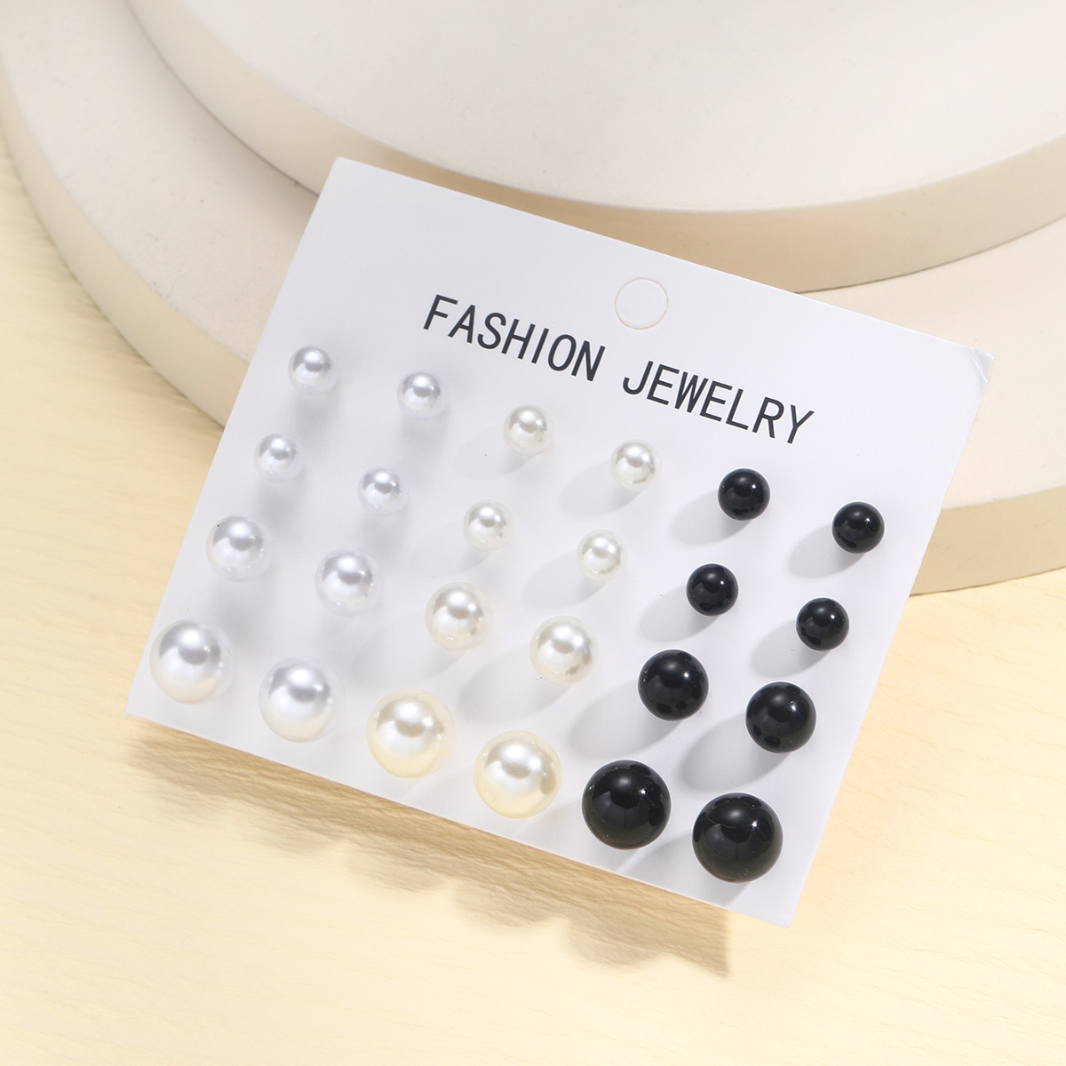 A new 12-piece set of simple European and American earrings for cross-border use, featuring a high-end retro three-color imitation pearl stud design Application Scenario
