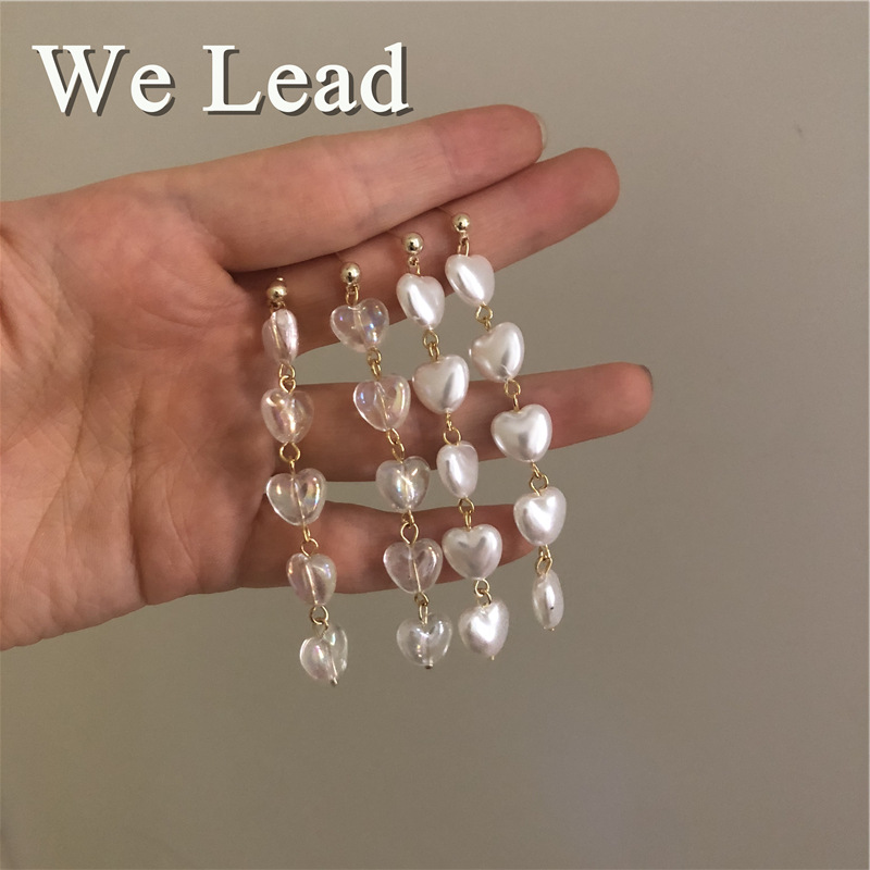 The manufacturer sells long heart-shaped Korean-style tassel earrings with white heart-shaped pearl tassel earrings and elegant bows full figure