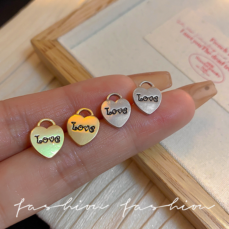 The matte earrings from Dongdaemun, South Korea, are simple, fashionable and versatile. They feature English letter metal heart-shaped earrings and earrings for young girls full figure