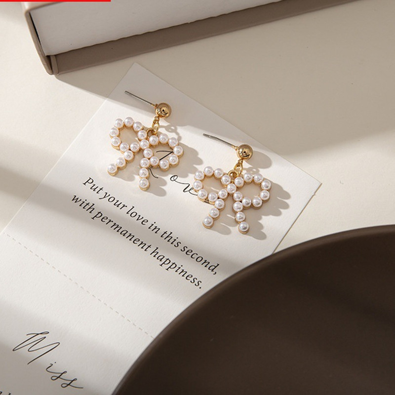 Trendy new Korean-style pearl butterfly pearl individual simple and elegant steel needle gold stud earrings for women details Picture