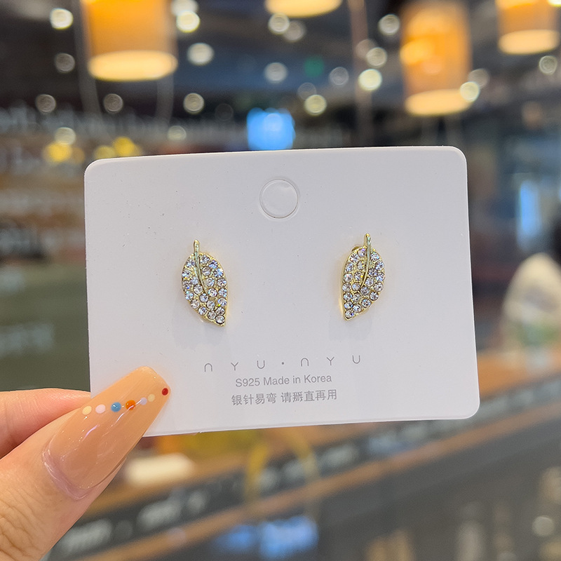 Personalized and simple tree leaf stud earrings with silver needles and slightly studded with diamonds, elegant and versatile earrings, a new trendy and niche earring that is popular among Internet celebrities details Picture