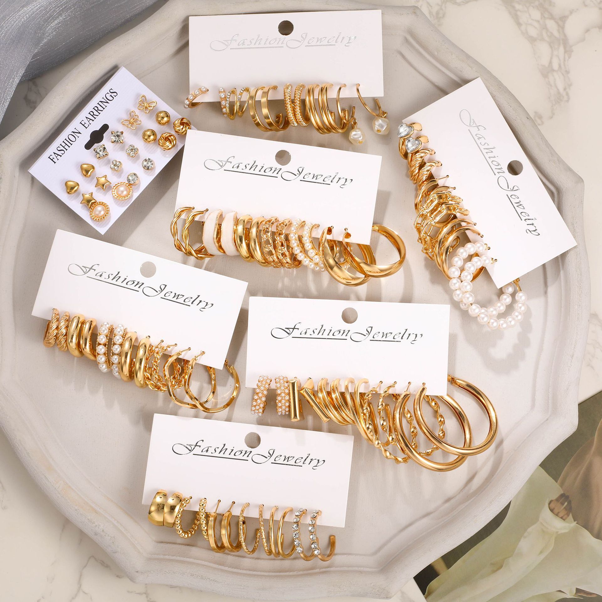 New cross-border European and American personalized heart-shaped imitation pearl hollowed-out C-shaped fashionable ins simple women's earrings 45-piece set details Picture