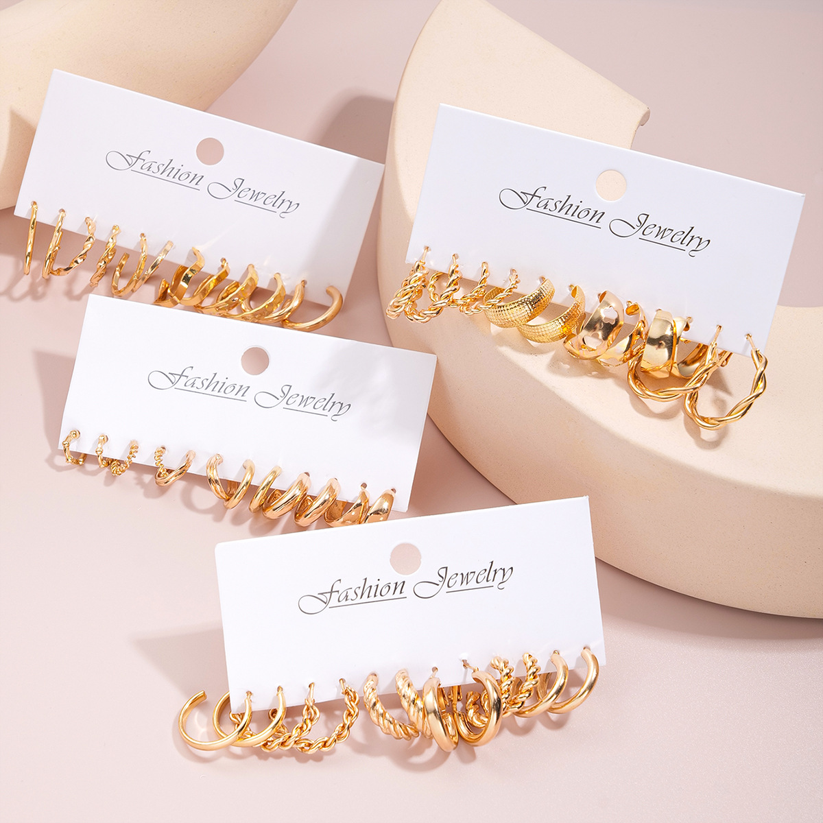 A new 24-piece set of cross-border metal C-shaped alloy heart-shaped earrings from Europe and America, featuring creative geometric twisted ear loops Application Scenario